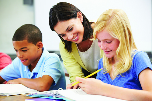 Teacher teaching children 